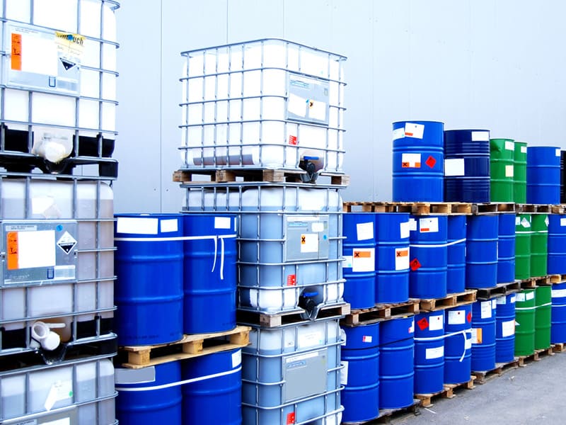 Various chemical barrels and containers, each has a label